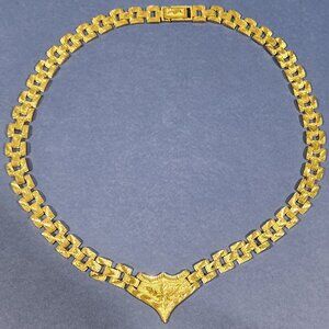 Flat Golden Coloured Necklace with Leaf & Crown Embellishments